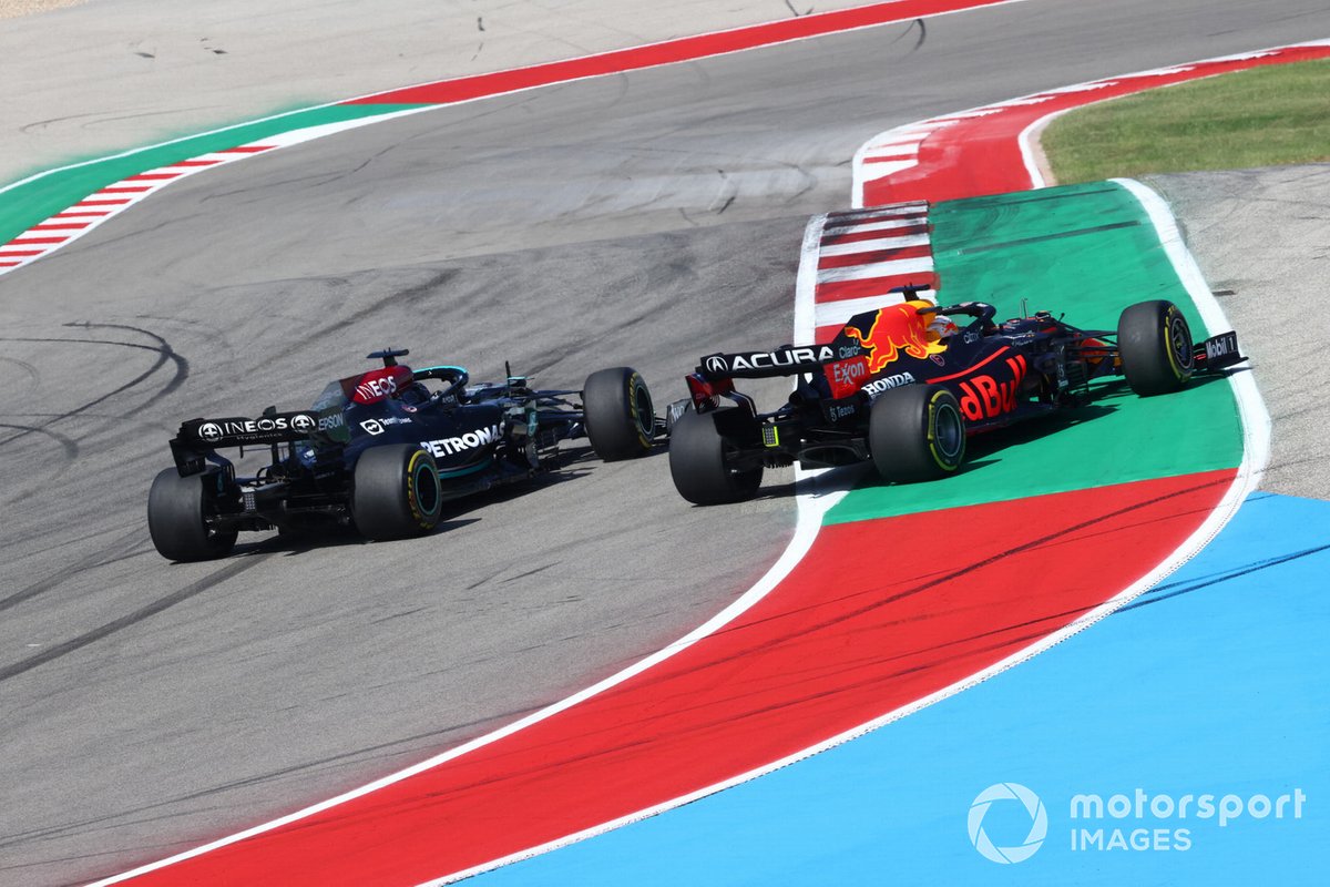 Max Verstappen, Red Bull Racing RB16B, battles with Lewis Hamilton, Mercedes W12, at the start