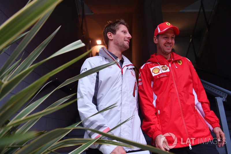 Romain Grosjean, Haas F1 Team, Sebastian Vettel, Ferrari