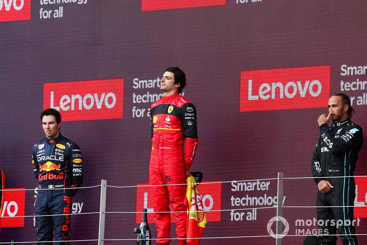 Sergio Perez, Red Bull Racing, 2nd position, Carlos Sainz, Ferrari, 1st position, Lewis Hamilton, Mercedes-AMG, 3rd position, on the podium