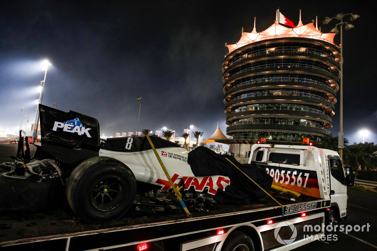 The remains of Romain Grosjean's Haas VF-20 on the back of a truck