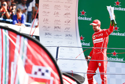 Third place Sebastian Vettel, Ferrari on the podium