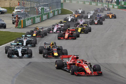 Sebastian Vettel, Ferrari SF71H, leads Max Verstappen, Red Bull Racing RB14, Valtteri Bottas, Merced
