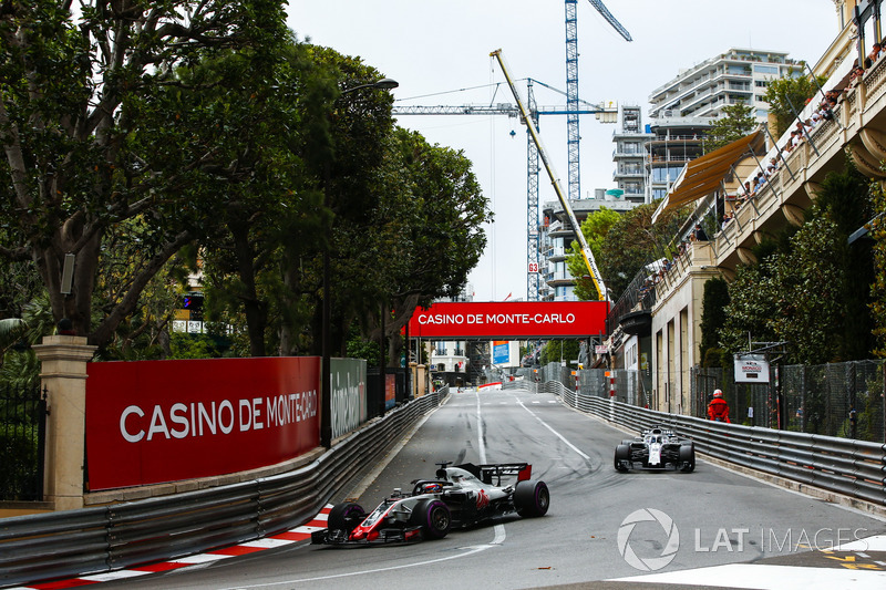 Romain Grosjean, Haas F1 Team VF-18, leads Lance Stroll, Williams FW41
