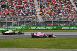 Sergio Perez, Force India VJM11 and Kevin Magnussen, Haas F1 Team VF-18