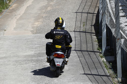 Nico Hulkenberg, Renault Sport F1 Team R.S. 18. receives a lift back to the pits on a moped