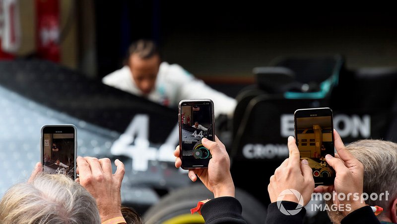Photos are taken with phones as Lewis Hamilton, Mercedes AMG F1, 1st position, inspects his car in Parc Ferme