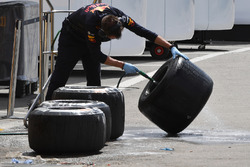 Red Bull Racing mechanic washes Pirelli tyres