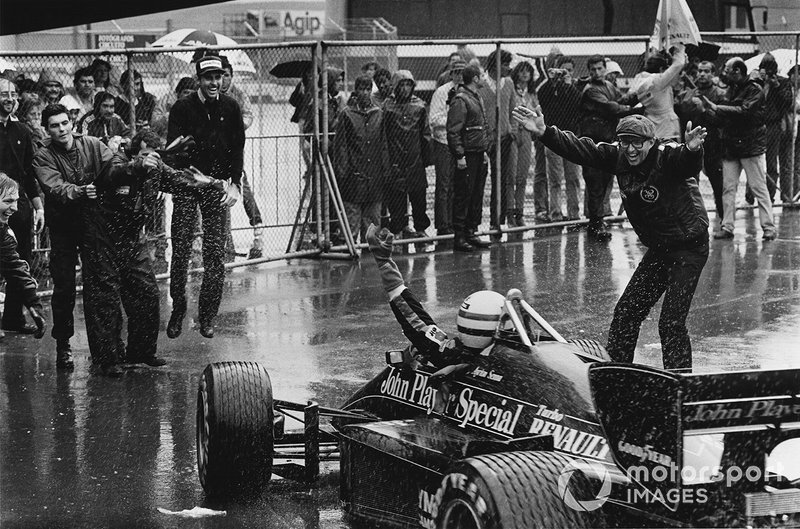 Ayrton Senna, Lotus 97T-Renault celebrates 1st position with Team Manager Peter Warr in parc ferme, portrait
