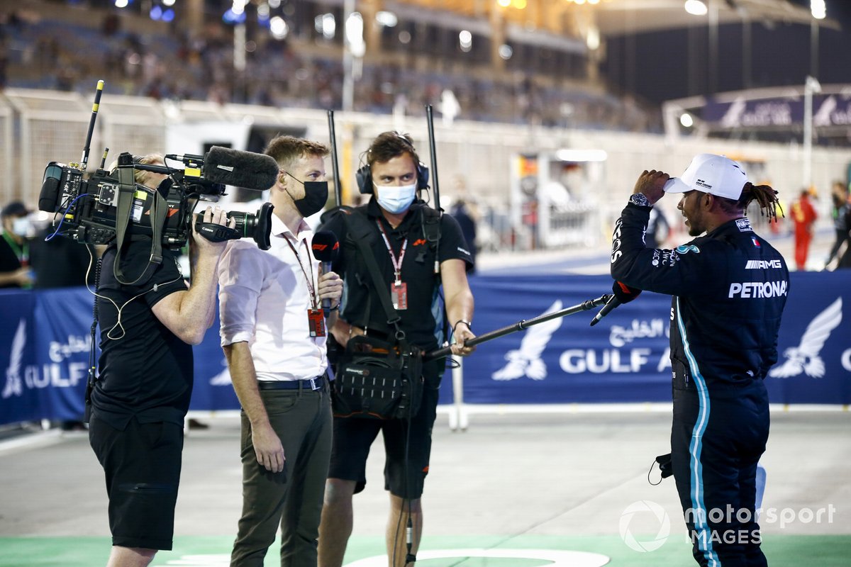Lewis Hamilton, Mercedes, 1st position, is interviewed by Jenson Button, Sky TV, after the race
