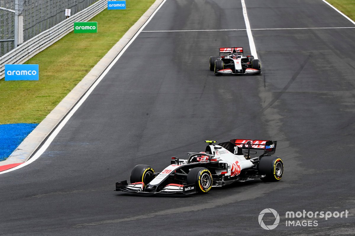 Kevin Magnussen, Haas VF-20, leads Romain Grosjean, Haas VF-20