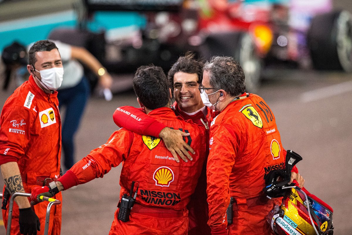 Third place Carlos Sainz Jr., Ferrari celebrates with team members