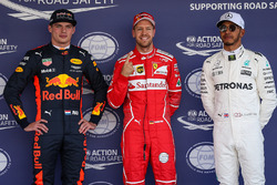 Pole winner Sebastian Vettel, Ferrari, talks to sceond place Max Verstappen, Red Bull Racing, third