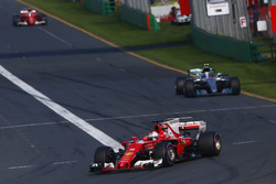 Sebastian Vettel, Ferrari SF70H, leads Valtteri Bottas, Mercedes AMG F1 W08, and Kimi Raikkonen, Ferrari SF70H