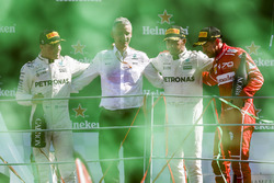 Second place Valtteri Bottas, Mercedes AMG F1, Race winner Third place Lewis Hamilton, Mercedes AMG F1 Sebastian Vettel, Ferrari, on the podium