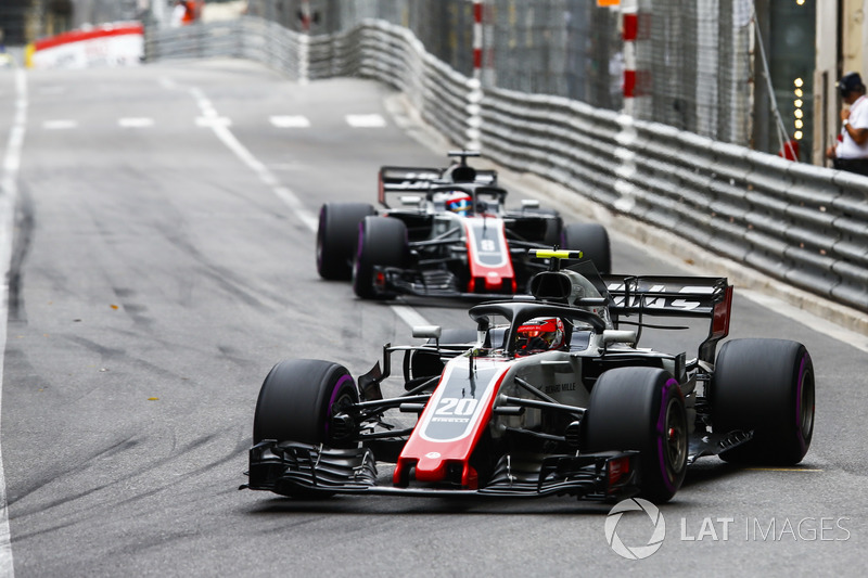 Kevin Magnussen, Haas F1 Team VF-18, leads Romain Grosjean, Haas F1 Team VF-18