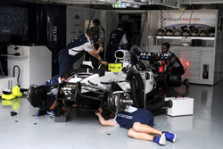 The car of Felipe Massa, Williams FW40 is worked on in the garage by mechanics