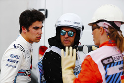 Lance Stroll, Williams Racing, talks to a marshal after an accident