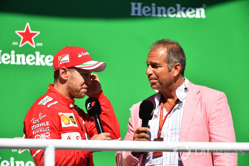 Podium: winner Sebastian Vettel, Ferrari with Kai Ebel