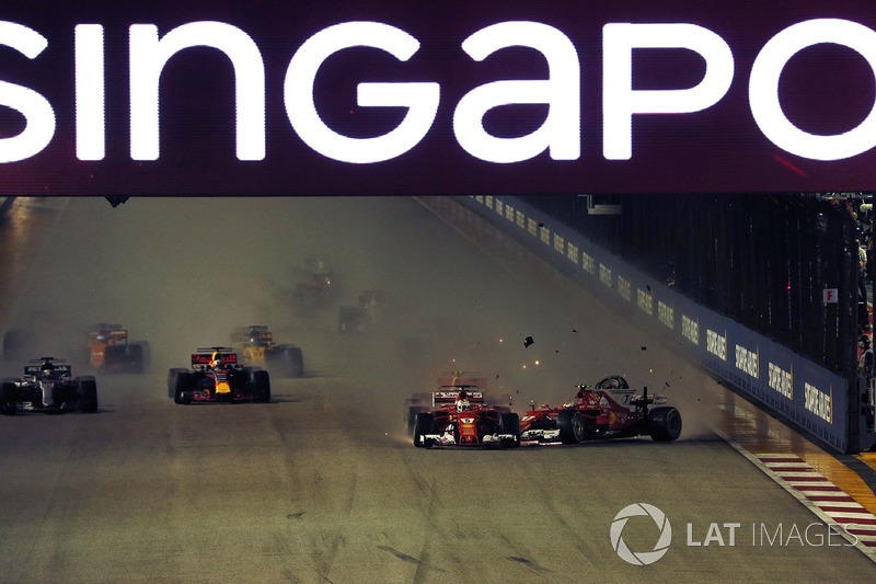Sebastian Vettel, Ferrari SF70H leads at the start of the race and the cars of Kimi Raikkonen, Ferrari SF70H and Max Verstappen, Red Bull Racing RB13 crash after colliding