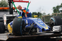 The damaged Sauber C35 of Marcus Ericsson, Sauber F1 Team is recovered back to the pits on the back of a truck during qualifying