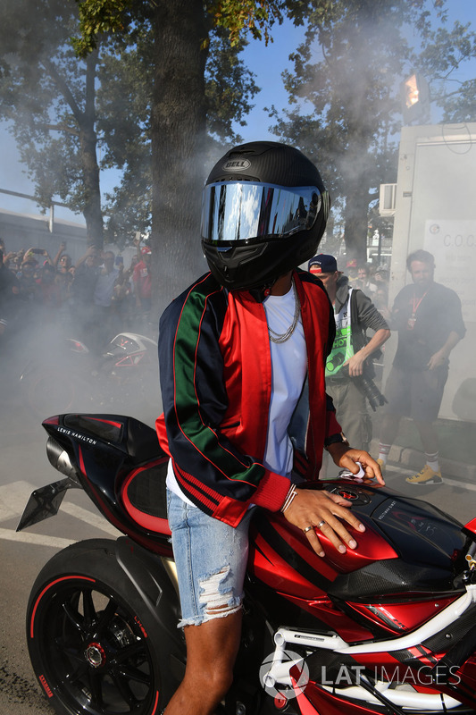 Lewis Hamilton, Mercedes AMG F1 arrives at the track on his motorbike