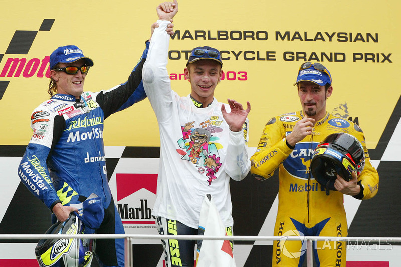 <img src="http://cdn-1.motorsport.com/static/custom/car-thumbs/MOTOGP_2017/RIDERS_NUMBERS/Rossi.png" width="55" /> #31 GP della Malesia 2003