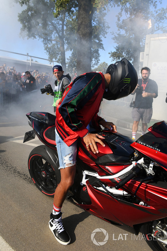 Lewis Hamilton, Mercedes AMG F1 arrives at the track on his motorbike