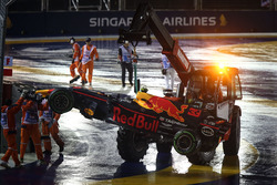 The car of Max Verstappen, Red Bull Racing RB13 is recovered by Marshals after crashing out at the start of the race
