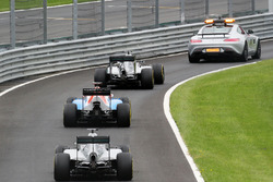 Nico Rosberg, Mercedes AMG F1 W07 Hybrid leads behind the FIA Safety Car as the field heads through