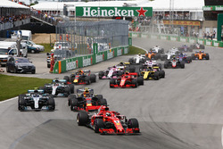 Sebastian Vettel, Ferrari SF71H, leads Max Verstappen, Red Bull Racing RB14, Valtteri Bottas, Merced