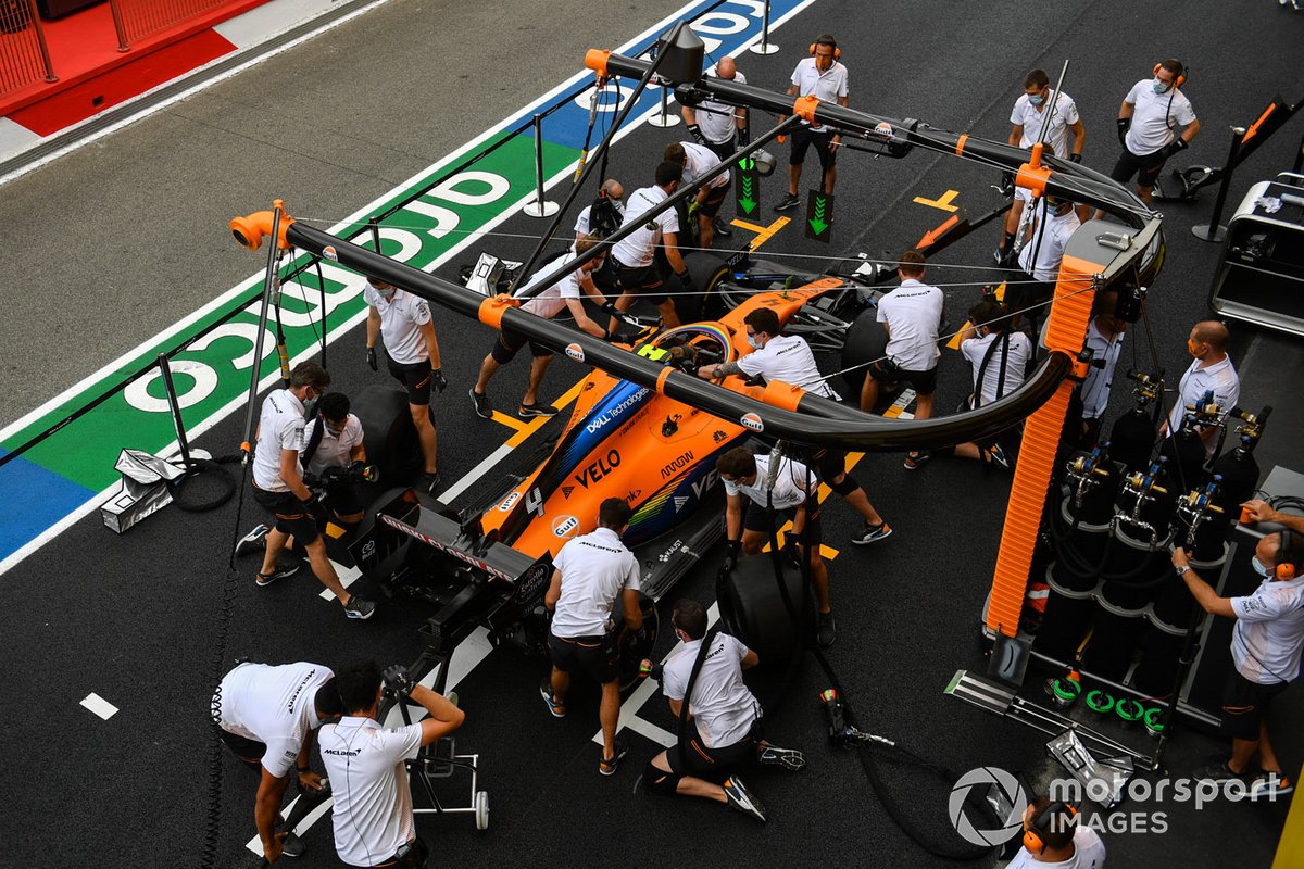McLaren mechanics practice a pitstop
