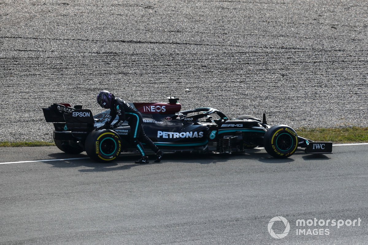 Lewis Hamilton, Mercedes, attends his car after a break down in FP2