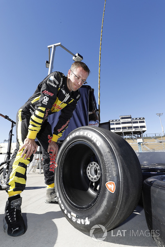 Sébastien Bourdais, Dale Coyne Racing with Vasser-Sullivan Honda examines his Firestone tires