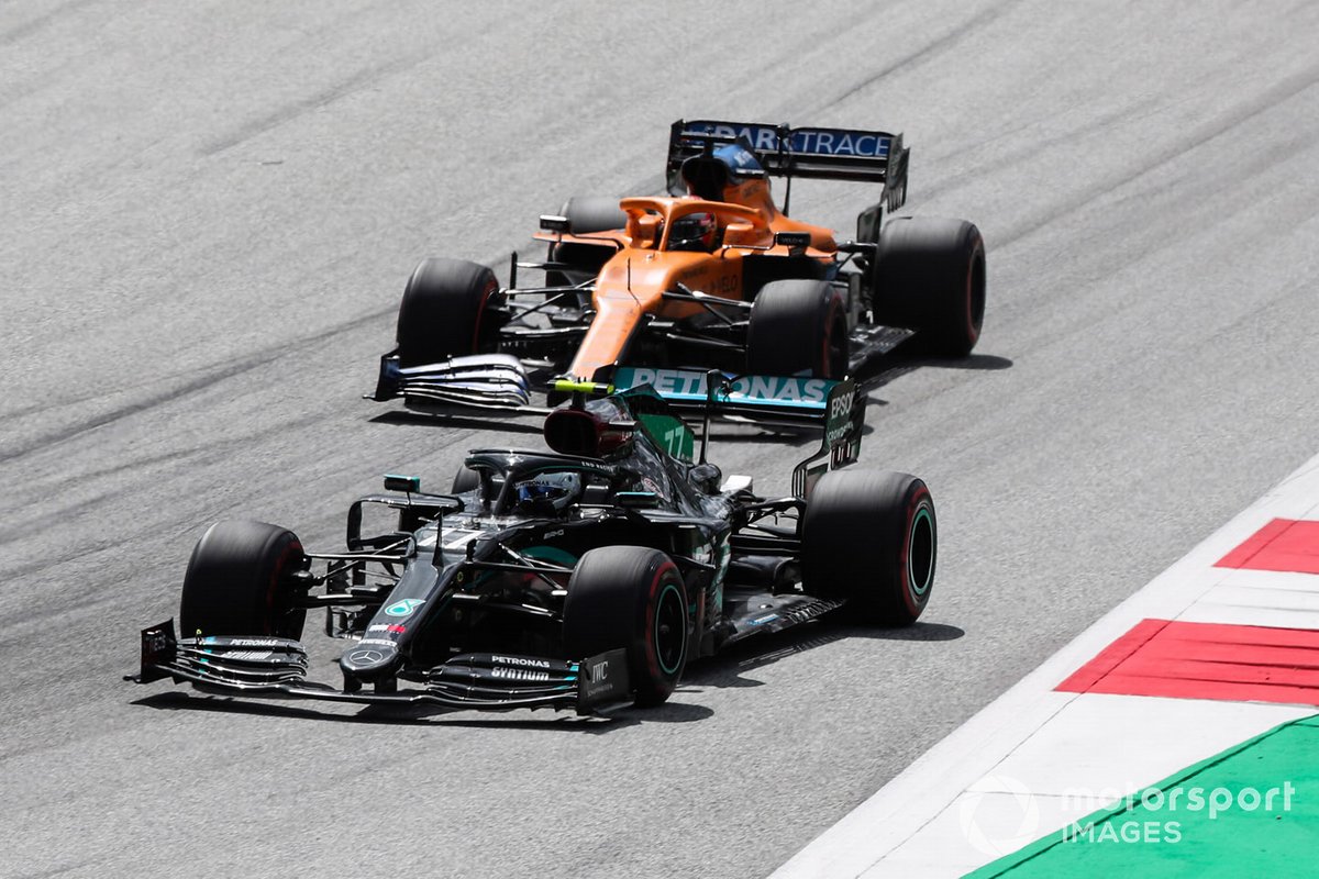 Valtteri Bottas, Mercedes F1 W11 EQ Performance, leads Carlos Sainz Jr., McLaren MCL35