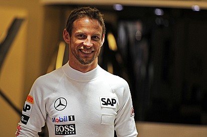 Button resorts to jokes as McLaren wait continues