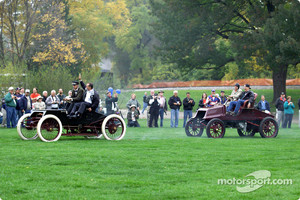 In a reenactment of Henry Ford's 1901 race victory over Alexander Winton, Ford's Glenn Miller and drag racing great Bob Glidden drive a replica of Ford's Sweepstakes racer to the lead