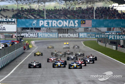The start: Fernando Alonso leads the field