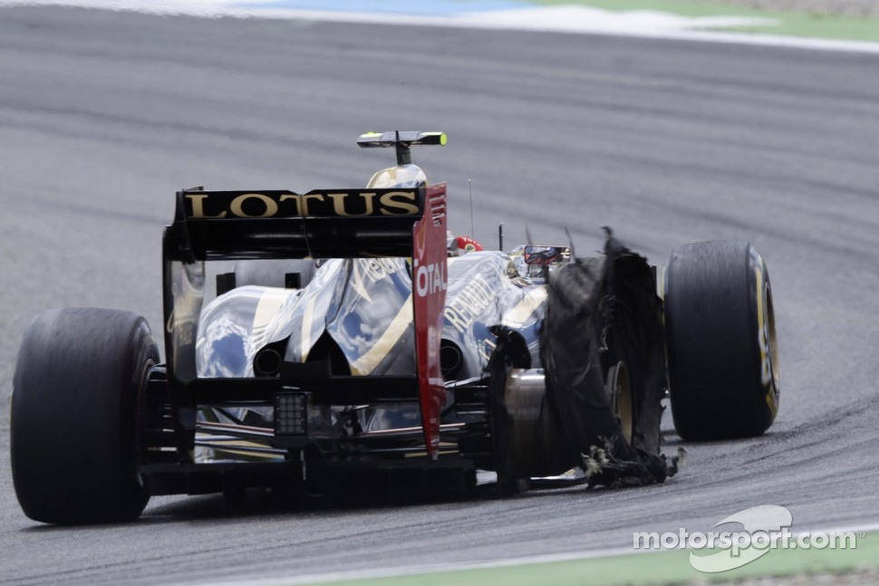 Romain Grosjean, Lotus F1 Team with a exploded tire puncher
