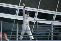 Race winner Juan Pablo Montoya heads to the podium