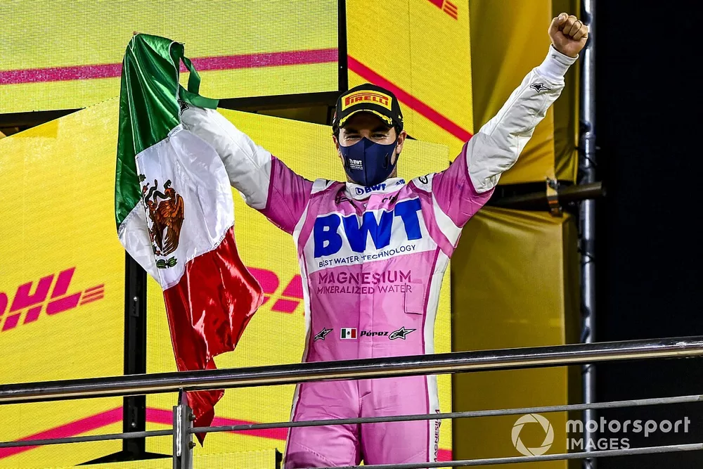 Sergio Perez, Racing Point, 1st position, on the podium with a Mexican flag