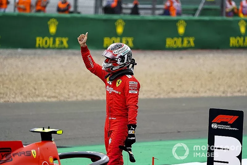 Charles Leclerc, Ferrari, waves to fans