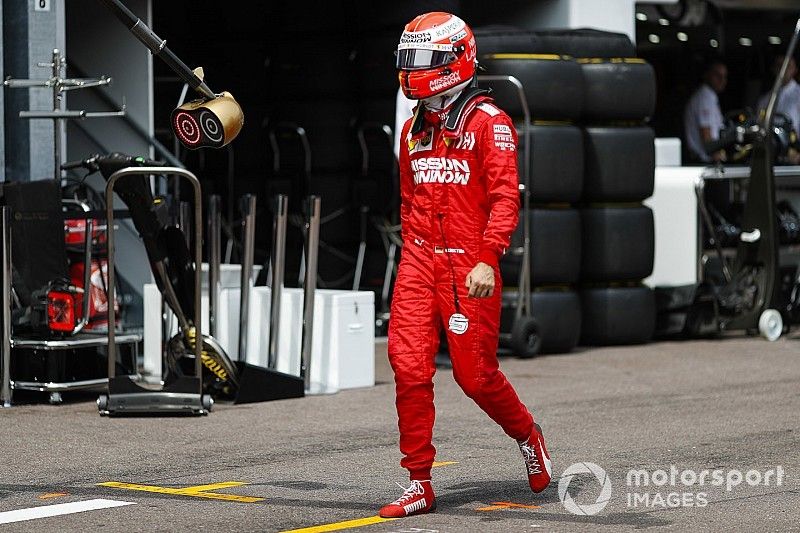 Sebastian Vettel, Ferrari walks back to his garage after crashing