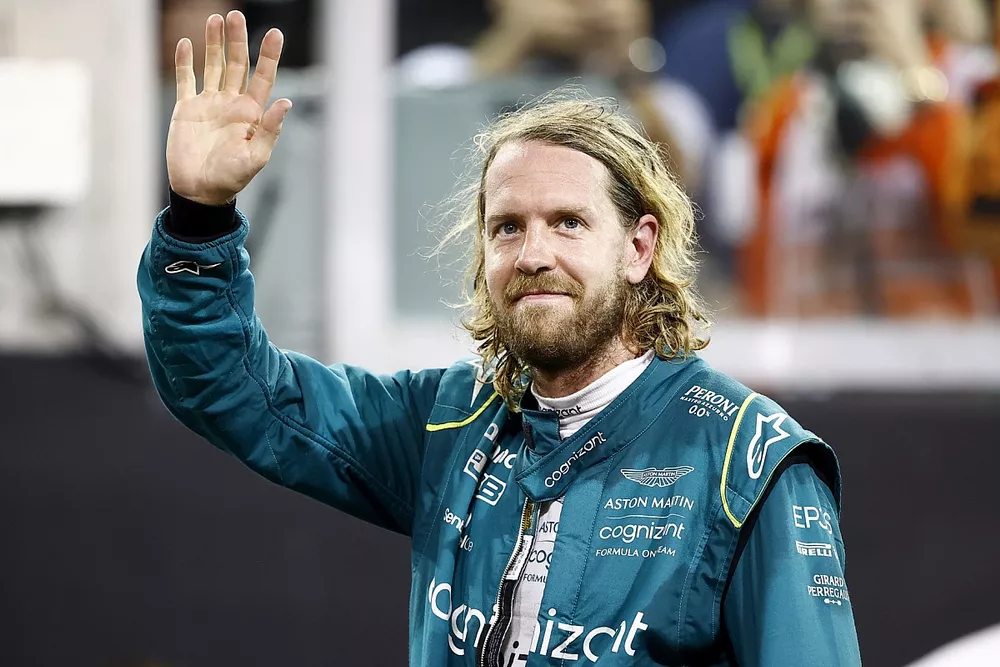 Sebastian Vettel, Aston Martin, waves to fans at the end of his final F1 race