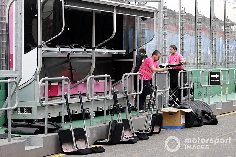 Racing Point personnel pack away their equipment on the pitwall