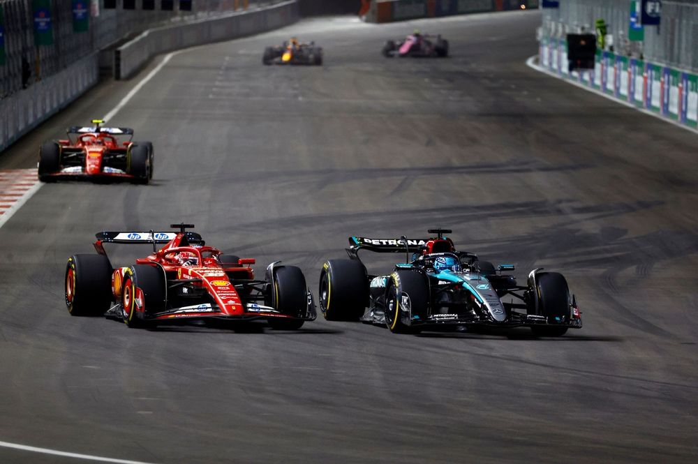 Charles Leclerc, Ferrari SF-24 battles with George Russell, Mercedes F1 W15 