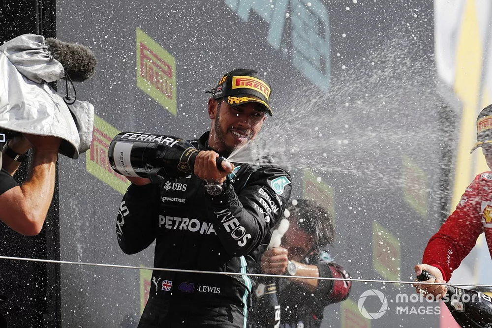 Lewis Hamilton, Mercedes, 1st position, sprays Champagne on the podium