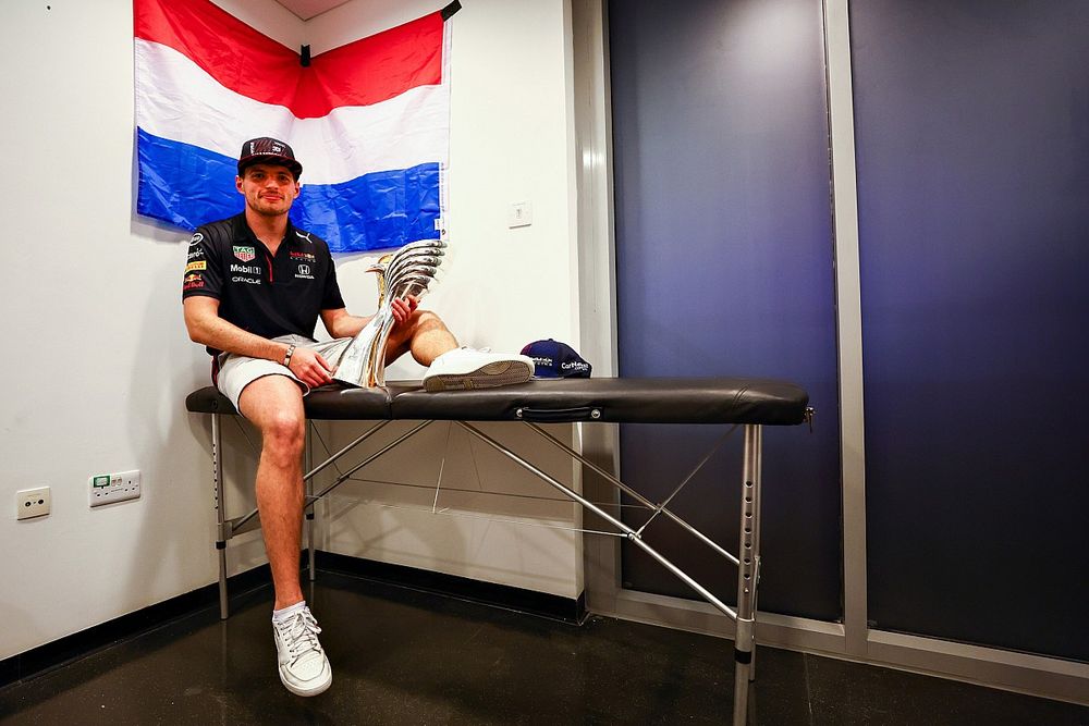 Race winner and 2021 F1 World Drivers Champion Max Verstappen, Red Bull Racing celebrates with his trophy