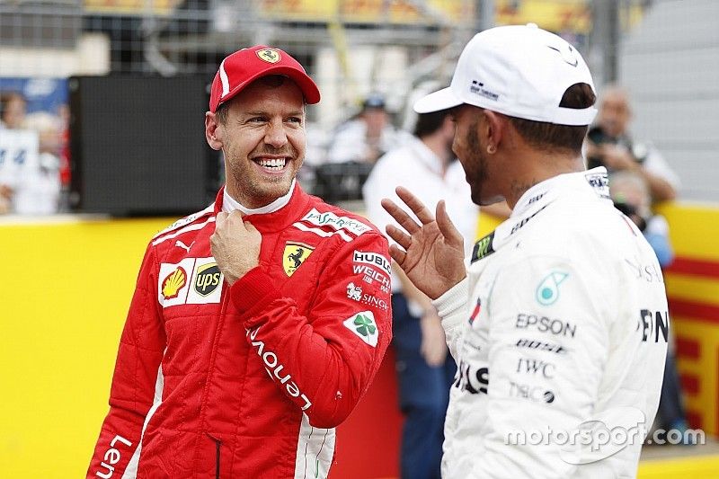 Third place Sebastian Vettel, Ferrari, and pole sitter Lewis Hamilton, Mercedes AMG F1