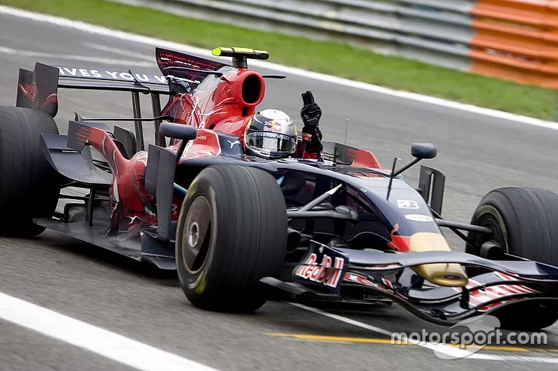 Sebastian Vettel, Scuderia Toro Rosso STR03 crosses the line to win his first GP