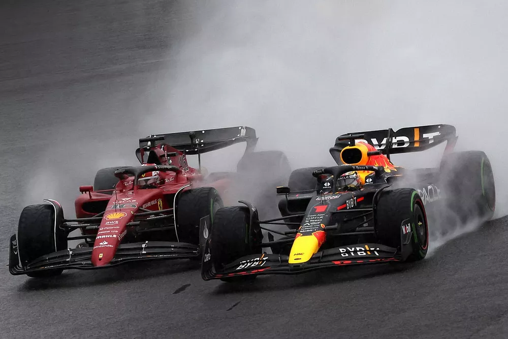 Max Verstappen, Red Bull Racing RB18, battles with Charles Leclerc, Ferrari F1-75